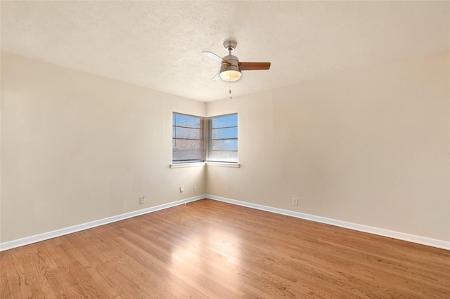 4021 Kenley St, Fort Worth, TX 76107 - spare room featuring light wood-style flooring, a ceiling fan, baseboards, and a textured ceiling