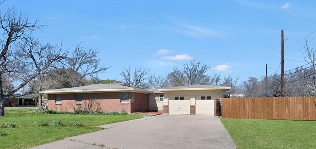 4021 Kenley St, Fort Worth, TX 76107 - ranch-style house with brick siding, a front lawn, fence, concrete driveway, and a garage