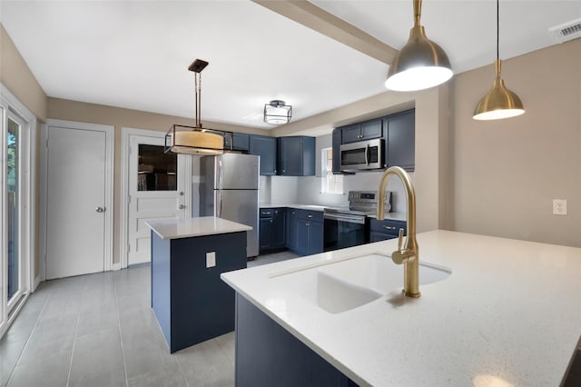 4021 Kenley St, Fort Worth, TX 76107 - kitchen featuring light countertops, blue cabinets, visible vents, and stainless steel appliances