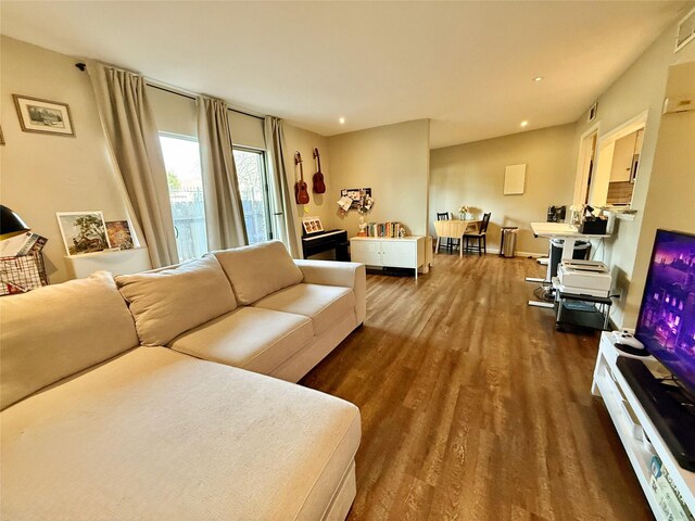 bedroom with wood finished floors, baseboards, and ceiling fan