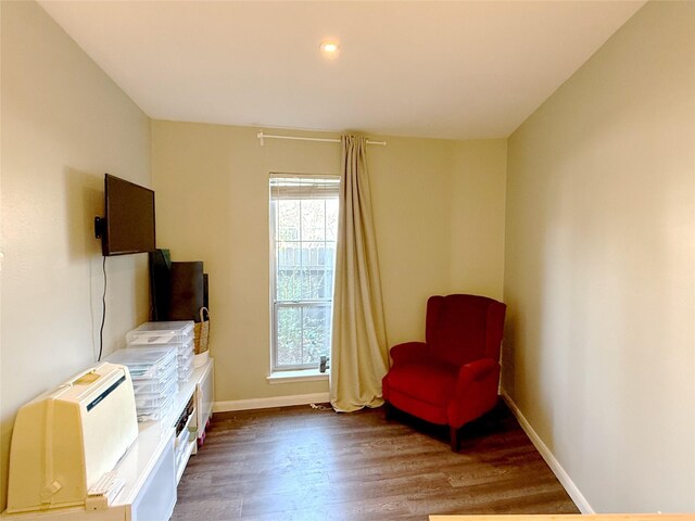 bedroom featuring wood finished floors, baseboards, and ceiling fan