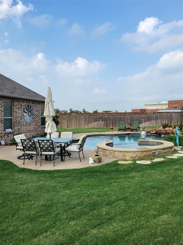 view of swimming pool featuring a yard, a fenced backyard, a patio, and an in ground hot tub