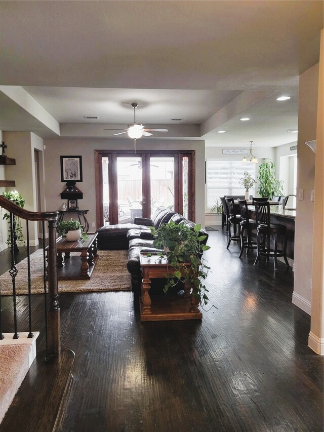living room featuring ceiling fan, baseboards, wood finished floors, and recessed lighting