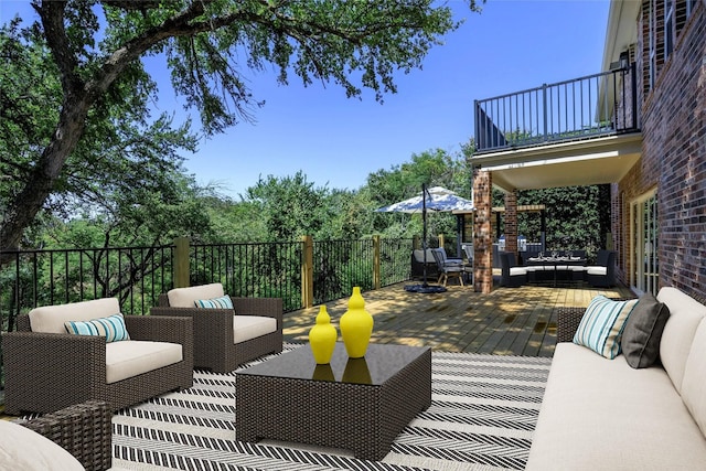 view of patio featuring a balcony and outdoor lounge area