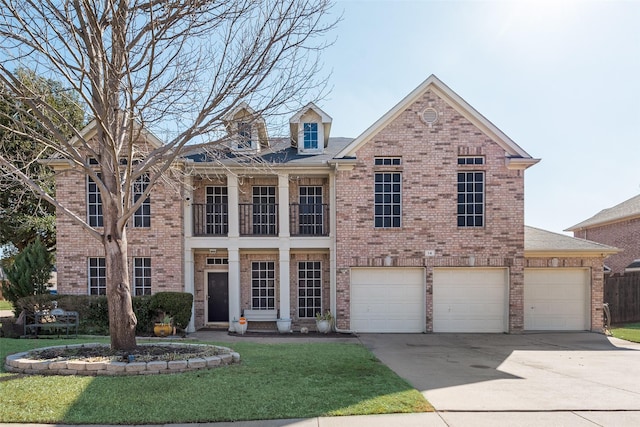 view of front of house featuring concrete driveway, a garage, brick siding, and a front yard
