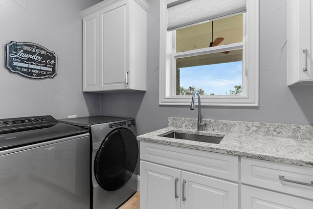639 Calm Water Cv, Princeton, TX 75407 - laundry area with washer and clothes dryer, cabinet space, and a sink
