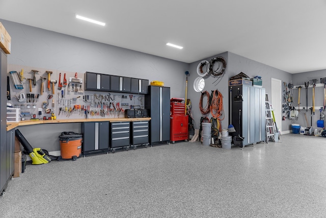 639 Calm Water Cv, Princeton, TX 75407 - garage with a workshop area