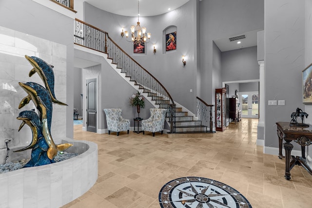 639 Calm Water Cv, Princeton, TX 75407 - entrance foyer with stairs, a high ceiling, and stone finish flooring