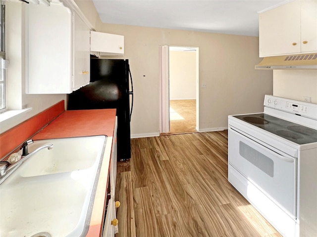 kitchen with white cabinetry, light wood-style floors, white electric range oven, a sink, and ventilation hood