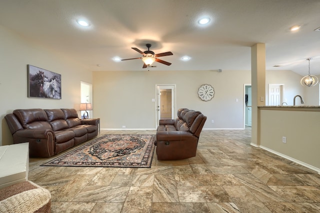 2710 Chalmers Ct, Rockwall, TX 75032 - living area featuring stone tile floors, baseboards, recessed lighting, ceiling fan, and vaulted ceiling
