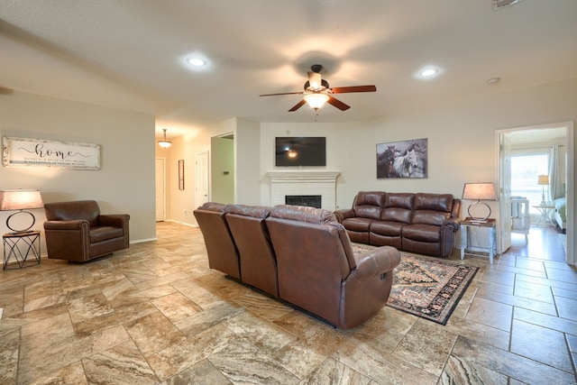 2710 Chalmers Ct, Rockwall, TX 75032 - living area with a ceiling fan, stone tile floors, a brick fireplace, recessed lighting, and baseboards