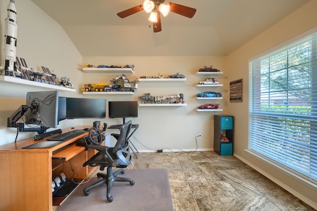 2710 Chalmers Ct, Rockwall, TX 75032 - home office featuring baseboards, a ceiling fan, vaulted ceiling, and stone finish flooring