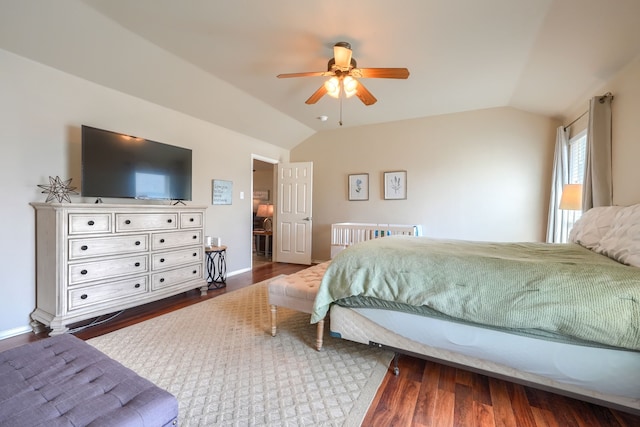 2710 Chalmers Ct, Rockwall, TX 75032 - bedroom with lofted ceiling, dark wood-style flooring, baseboards, and ceiling fan