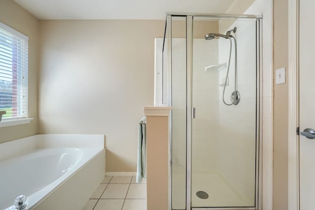 2710 Chalmers Ct, Rockwall, TX 75032 - full bath with plenty of natural light, a shower stall, a garden tub, and tile patterned flooring