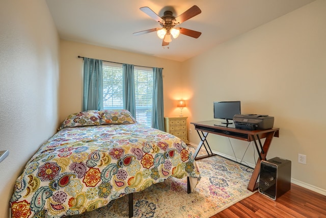 2710 Chalmers Ct, Rockwall, TX 75032 - bedroom featuring wood finished floors, baseboards, and a ceiling fan
