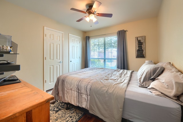 2710 Chalmers Ct, Rockwall, TX 75032 - bedroom featuring dark wood-type flooring and ceiling fan