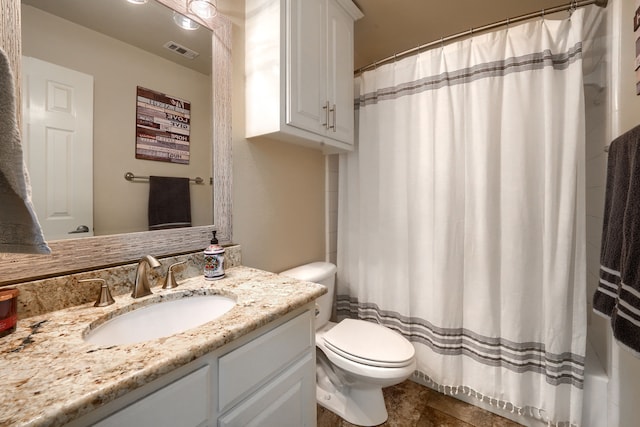 2710 Chalmers Ct, Rockwall, TX 75032 - bathroom with toilet, vanity, and curtained shower