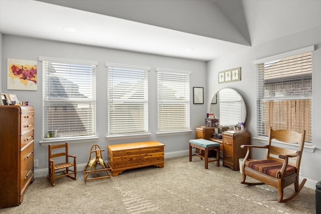 living area with carpet flooring and baseboards