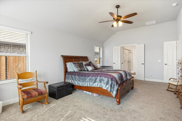 carpeted bedroom with visible vents, baseboards, ceiling fan, and vaulted ceiling