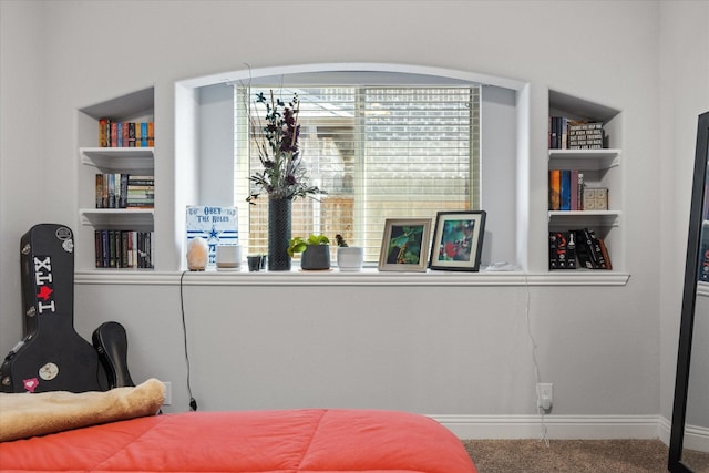 bedroom with carpet flooring and baseboards