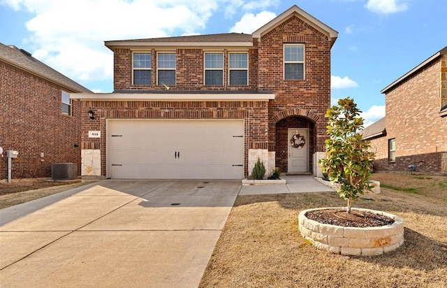 traditional-style house with brick siding, central AC unit, concrete driveway, and a garage