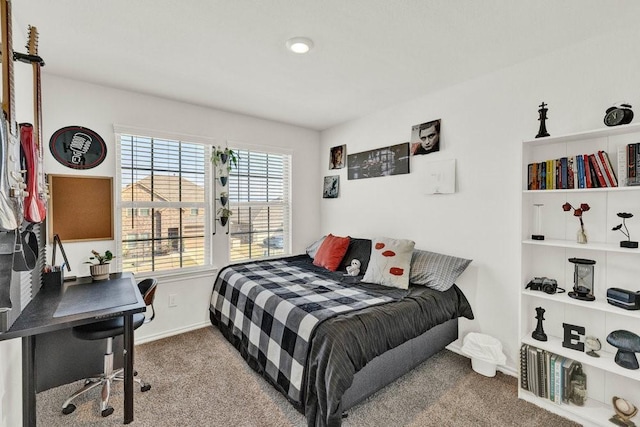 bedroom with carpet and baseboards