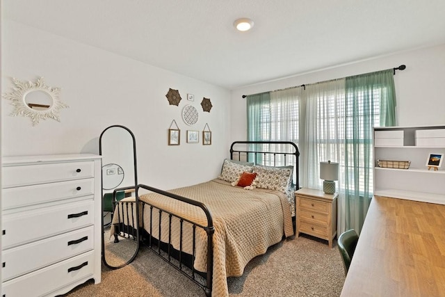 bedroom with wood finished floors