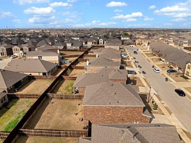 birds eye view of property with a residential view