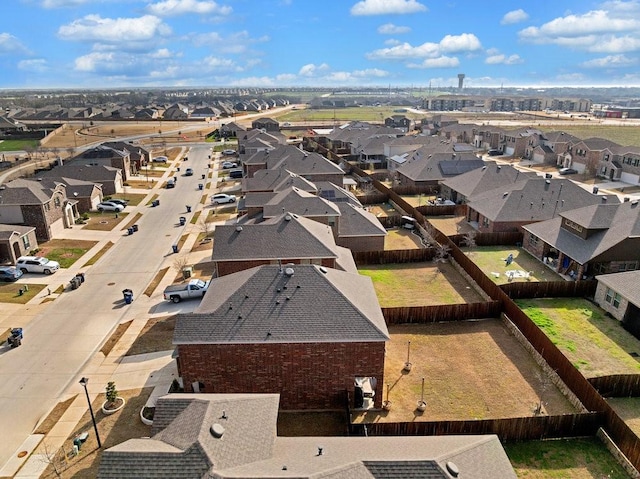 birds eye view of property with a residential view