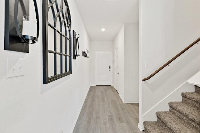 815 Cormorant St, Princeton, TX 75407 - hallway with stairway, light wood finished floors, baseboards, and recessed lighting