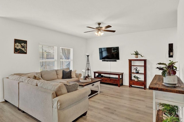 living room with light wood-style flooring and ceiling fan