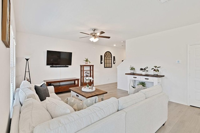 living area with recessed lighting, baseboards, ceiling fan, and light wood finished floors