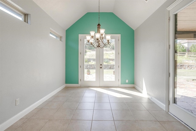 doorway to outside featuring tile patterned flooring, baseboards, lofted ceiling, french doors, and an inviting chandelier