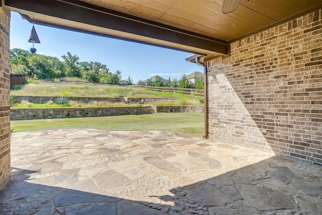 view of patio featuring fence