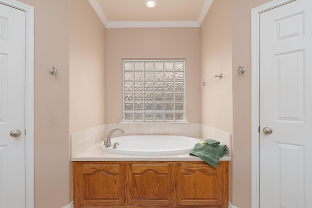 full bath featuring a garden tub and ornamental molding