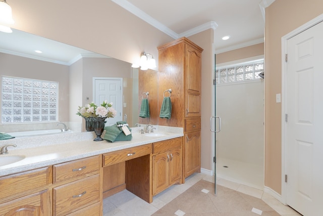 bathroom with tile patterned flooring, crown molding, a shower stall, and a sink