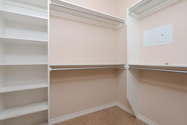 walk in closet featuring tile patterned flooring