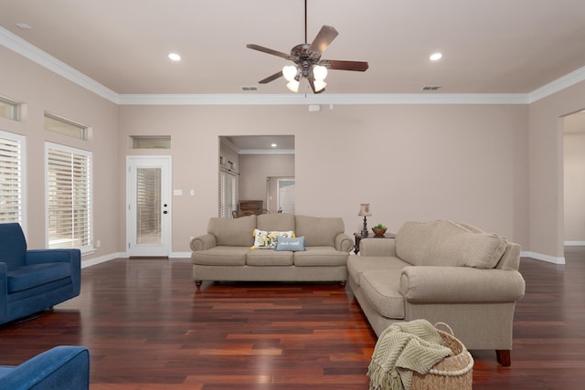 living room with visible vents, baseboards, ornamental molding, wood finished floors, and a ceiling fan