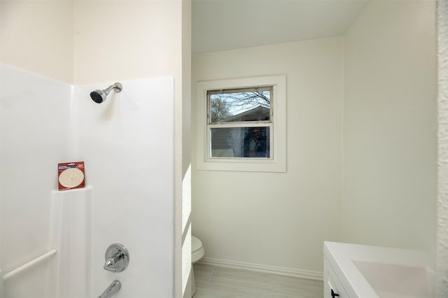 full bathroom with vanity, shower / bathing tub combination, toilet, and baseboards