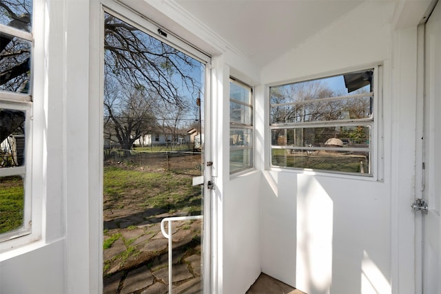 exterior space with vaulted ceiling