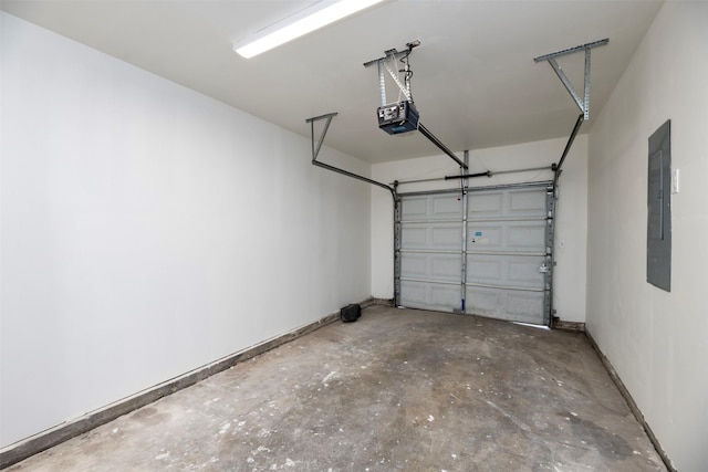 garage featuring electric panel, a garage door opener, and baseboards