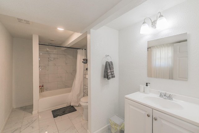 bathroom featuring baseboards, toilet, shower / bath combination with curtain, vanity, and marble finish floor
