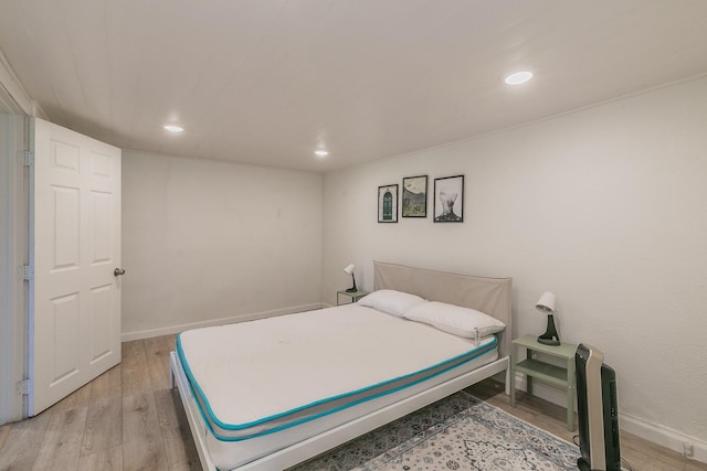 bedroom featuring recessed lighting, baseboards, and light wood-style floors