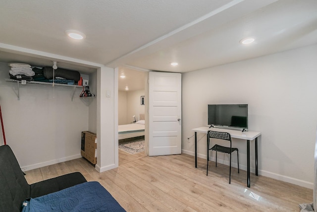 bedroom featuring recessed lighting, baseboards, and wood finished floors
