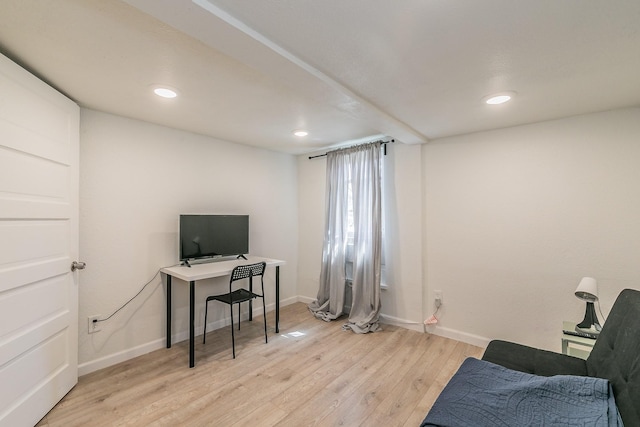 office space featuring recessed lighting, light wood-type flooring, and baseboards