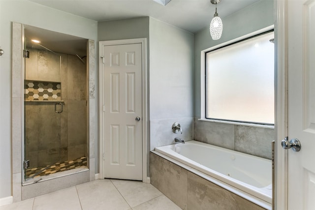 full bath featuring a bath, tile patterned flooring, and a stall shower