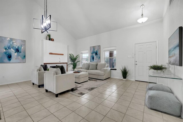 1121 Basswood Ln, Royse City, TX 75189 - living room with high vaulted ceiling, baseboards, light tile patterned flooring, and visible vents