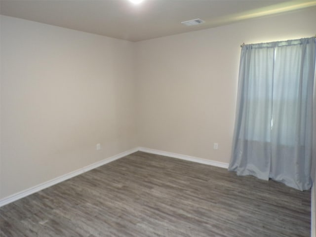 18287 County Road 4001, Mabank, TX 75147 - unfurnished room with dark wood-style floors and baseboards