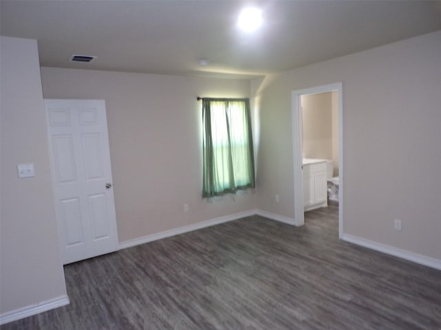 18287 County Road 4001, Mabank, TX 75147 - spare room with dark wood-style floors and baseboards