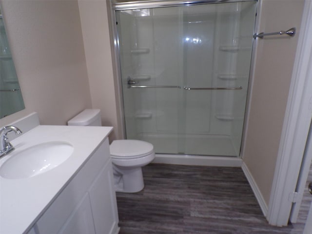 18287 County Road 4001, Mabank, TX 75147 - bathroom featuring wood finished floors, a stall shower, toilet, and vanity